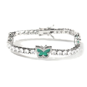 Detail of silver tennis chain with zircon stones and green malachite butterfly pendant