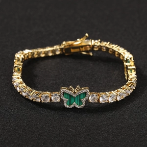 Iced out gold butterfly tennis necklace with green stone wings and white zircon stones