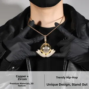 Hip hop pendant with golden globe and zircon wings worn by model on rope chain