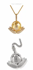 Detail of hip hop Earth globe pendant with 5A zircon inlay and all-seeing eye design