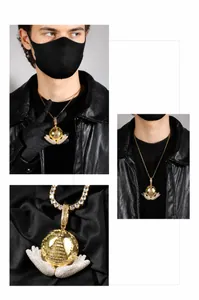 Close-up of hip-hop globe pendant with hands holding earth and cubic zirconia inlay