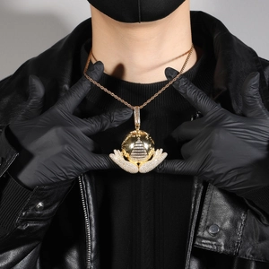 Close-up of hip hop pendant featuring gold earth and all-seeing eye with 5A zircons