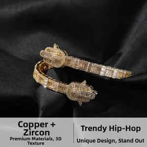 Detailed shot of golden hip-hop hand bracelet with zircons on black silk background