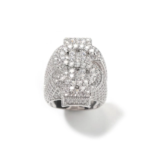 Macro shot of silver hip-hop ring with iced-out dollar sign and micro-pave zircons