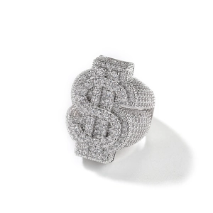 Macro detail of silver hip-hop dollar sign ring with sparkling pavé set rhinestones