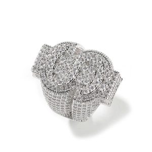 Macro detail of iced-out silver hip-hop dollar sign ring with sparkling zircon stones