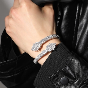 Detailed macro view of Hamsa Hand bracelet with pave-set cubic zirconia on black leather
