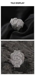 Macro view of iced-out silver dollar sign ring showing detailed micro-pave crystals