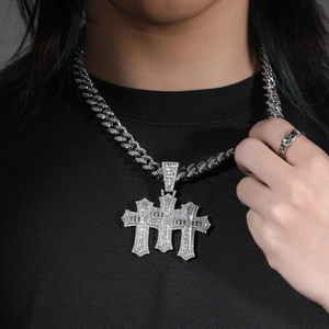 Hip-hop silver cross pendant with sparkling zircons on a heavy cuban link chain