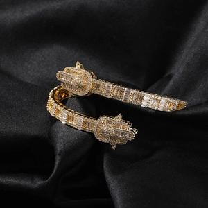 Hamsa hand open bangle in gold finish with micro-pave white zircon stones for hip hop style