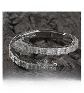 Detailed macro view of Hamsa Hand iced-out bracelet with square and round zircons