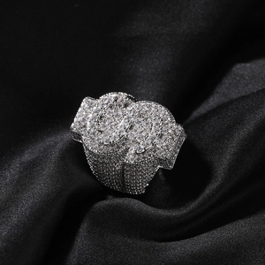 Hip-hop silver iced out dollar sign ring with sparkling stones on black silk
