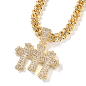 Close-up of hip-hop cross pendant and Cuban link chain with full zircon inlay
