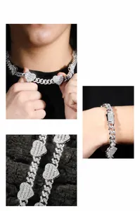 Detail view of iced-out Cuban link chain and bracelet with heart zircon stones