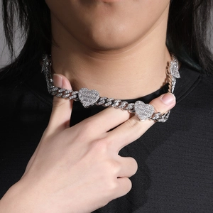 Close-up of hip hop cuban link necklace with iced out heart pendants for men