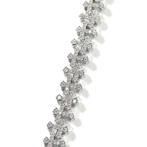Detail shot of iced-out cross link necklace with sparkling crystals in gothic punk style