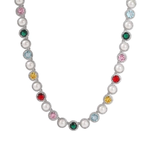 Macro detail of multicolored gemstone and pearl necklace with sparkling pavé setting