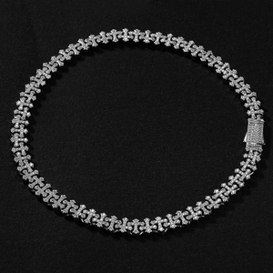 Close-up of iced out hip hop cross chain necklace with sparkling zircon diamonds