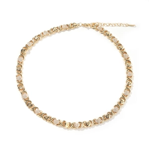 Detailed close-up of gold-plated XO necklace with crystal-paved heart links