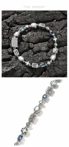 Detail showing blue gemstone and white opal inlay with zircon accents on a silver bracelet