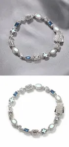 Detail of silver bracelet with blue gemstones, opal stones and cross motif clasp
