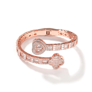 Detail view of rose gold clover and heart bangle with sparkling cubic zirconia inlay