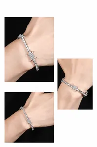 Macro detail of silver tennis bracelet with hip hop barbed wire thorns and white zircons