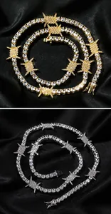 Detail of hip hop thorn tennis necklace with gold and silver finishes and zircon stones