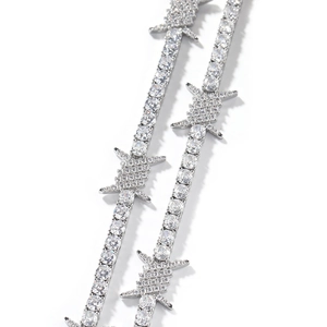 Macro shot of silver hip-hop barbed wire tennis necklace with cubic zirconia
