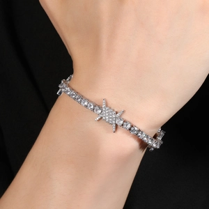 Close-up of hip-hop silver tennis bracelet with cubic zirconia and barbed wire design
