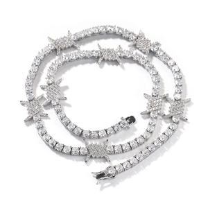 Detail of silver plated hip hop tennis necklace with barbed wire design and cubic zirconia