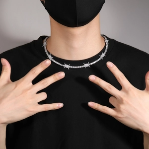 Close-up of hip hop silver necklace with thorn links and cubic zirconia tennis chain