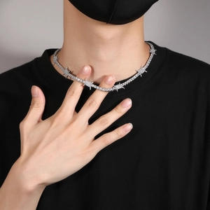 Close-up of hip hop thorn tennis necklace with sparkling cubic zirconia on a model