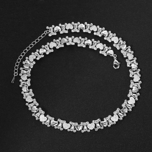 Silver bear and heart choker necklace with micro-paved zircons on black background