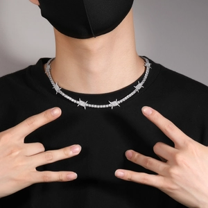 Hip hop thorn tennis necklace with sparkling cubic zirconia on male model's neck