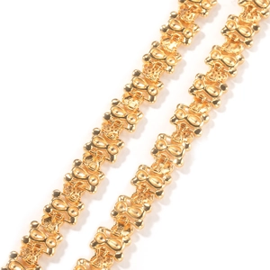 Macro view of 11mm gold chain link necklace with a polished abstract bone-like structure