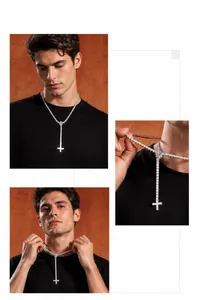 Close-up of hip hop tennis chain with iced-out cross pendant in silver finish