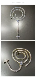 Close-up of gold and silver tennis chain necklaces with drop-cut stones and cross pendants