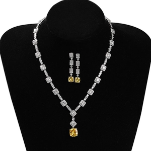 Luxuriöses Schmuckset aus Kupfer mit gelben Citrin-Edelsteinen und glänzenden Zirkonia