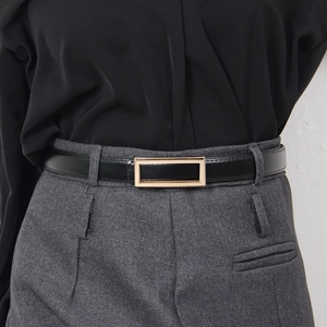 Minimalist black leather belt for women featuring a sleek rectangular gold metal buckle