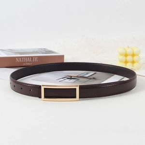 Detail of dark brown leather belt with gold rectangular buckle on an aesthetic setup