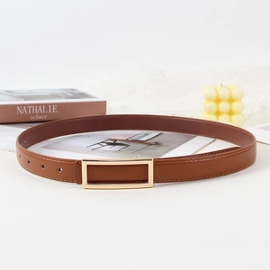 Brown leather belt with gold rectangular buckle shown on white surface with decor