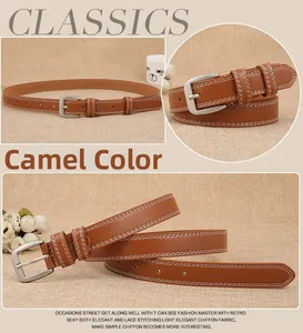 Detail of camel leather belt with white stitching and silver buckle for dresses