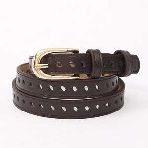 Macro detail of dark coffee leather belt with gold pin buckle and full-length hollow holes