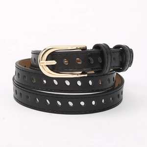 Close-up of thin black leather belt with golden U-shaped buckle and all-over perforations