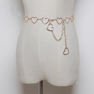 Polished gold metal waist chain with heart-shaped links on a white dress form