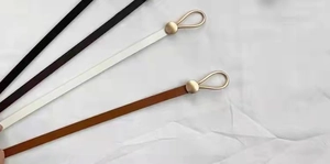 Slim faux leather waist belts in black white and brown with matte gold round buckles