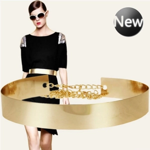 Close-up of a wide gold mirror metal corset belt featuring an adjustable chain closure
