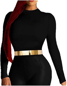 Detail of a wide gold mirror metal belt on a black slim fit long sleeve outfit for women