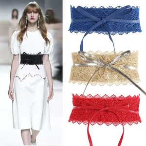 Lace corset belt detail with criss-cross straps and scalloped edges in multi-colors
